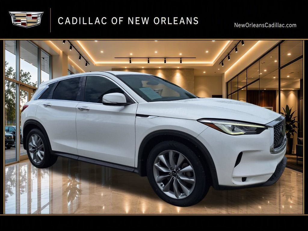 2021 INFINITI QX50 PURE in Lunar White — front three-quarter view